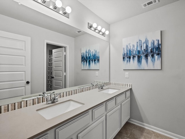2712 Ahnya Ln, League City, TX 77573 - bathroom with tile patterned flooring, a sink, baseboards, and visible vents