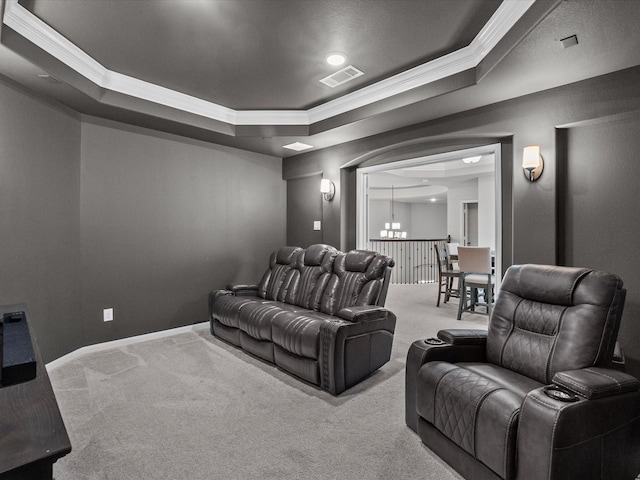 2712 Ahnya Ln, League City, TX 77573 - carpeted home theater with ornamental molding, visible vents, a notable chandelier, and a raised ceiling
