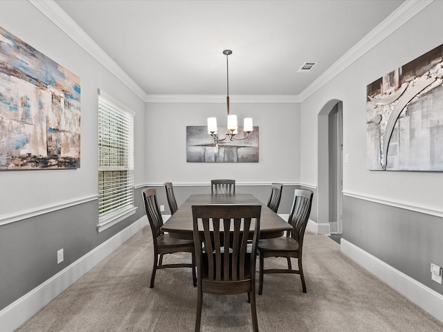 2712 Ahnya Ln, League City, TX 77573 - carpeted dining area featuring ornamental molding, a notable chandelier, arched walkways, and visible vents