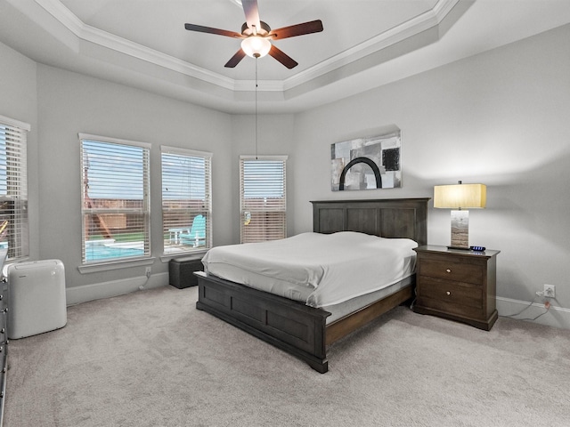 2712 Ahnya Ln, League City, TX 77573 - bedroom with carpet floors, ornamental molding, and a tray ceiling