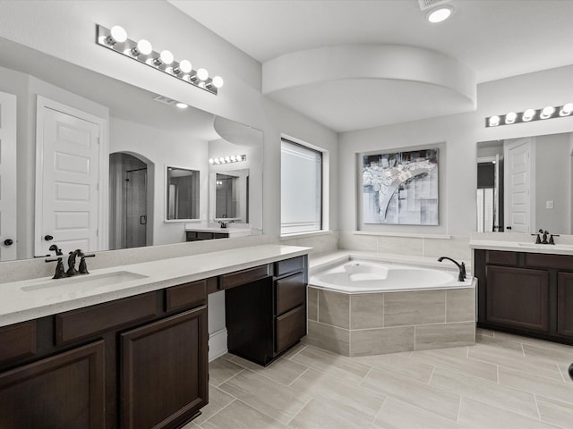 2712 Ahnya Ln, League City, TX 77573 - bathroom with a shower, a sink, two vanities, and a garden tub