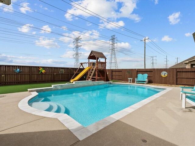 2712 Ahnya Ln, League City, TX 77573 - view of swimming pool with a patio, a fenced in pool, a fenced backyard, and a water slide