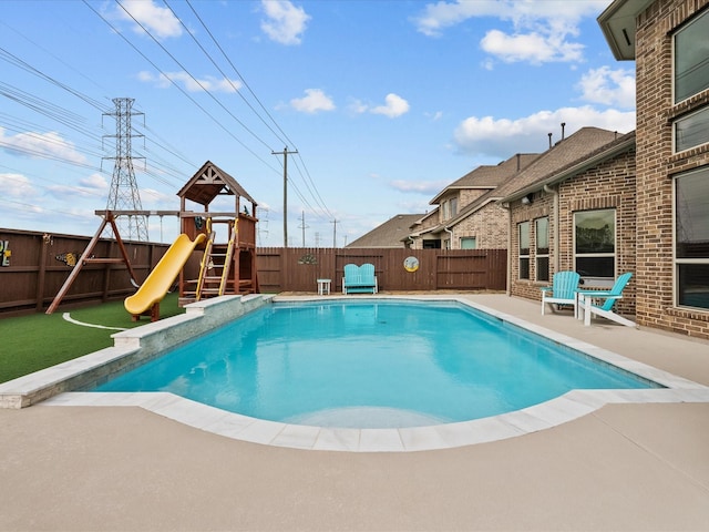 2712 Ahnya Ln, League City, TX 77573 - view of pool with a patio, a fenced backyard, a water slide, a fenced in pool, and a playground