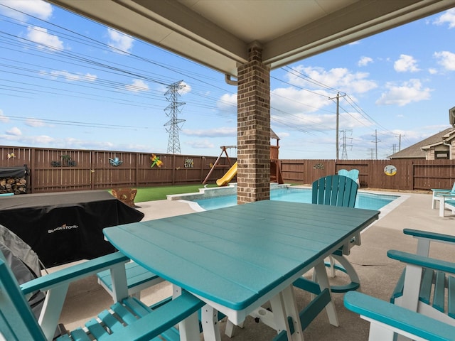 2712 Ahnya Ln, League City, TX 77573 - view of patio / terrace featuring a fenced in pool, a fenced backyard, and outdoor dining space