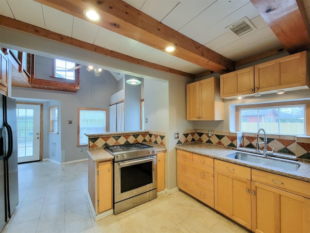 810 E 28th St, Houston, TX 77009 - kitchen featuring stainless steel gas range, a sink, backsplash, beamed ceiling, and visible vents