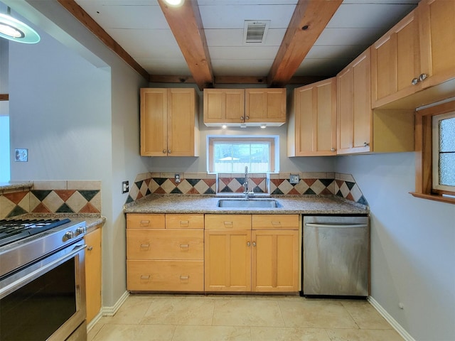 810 E 28th St, Houston, TX 77009 - kitchen with decorative backsplash, visible vents, appliances with stainless steel finishes, beam ceiling, and a sink