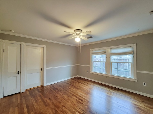 810 E 28th St, Houston, TX 77009 - interior space with crown molding, ceiling fan, wood finished floors, and visible vents