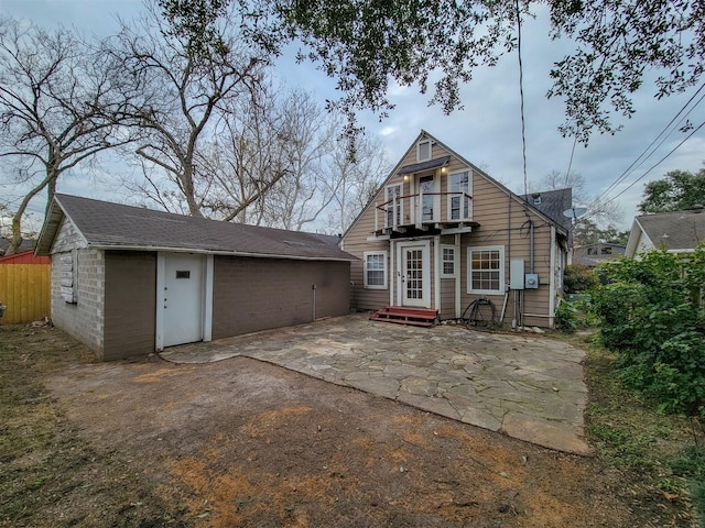 810 E 28th St, Houston, TX 77009 - rear view of house featuring a patio, an outbuilding, a balcony, and entry steps