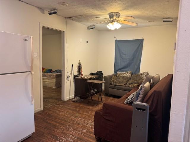 7511 Bonham St, Houston, TX 77020 - living area featuring ceiling fan and wood finished floors