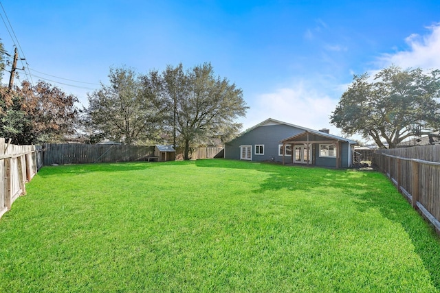 view of yard featuring a fenced backyard