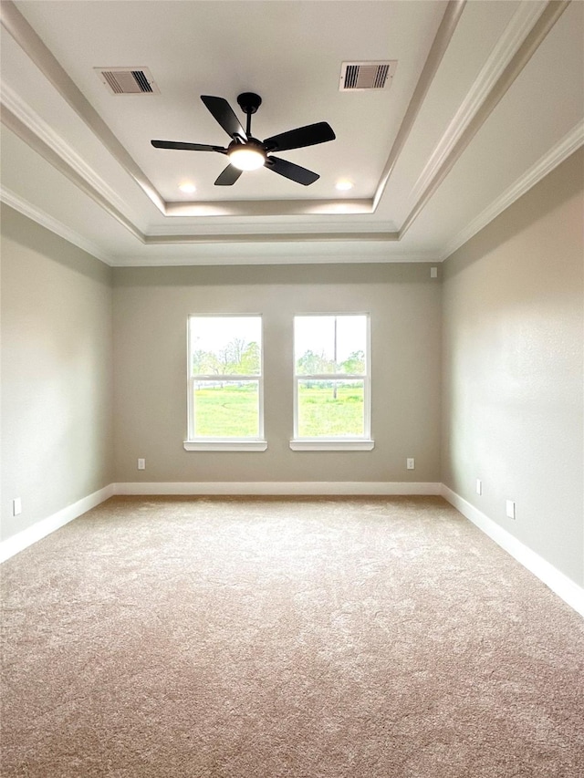 635 Lily St, Prairie View, TX 77484 - unfurnished room featuring a raised ceiling, light colored carpet, ornamental molding, ceiling fan, and baseboards