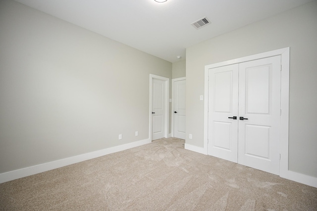 635 Lily St, Prairie View, TX 77484 - unfurnished bedroom featuring light carpet and a closet