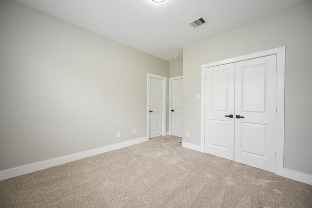 635 Lily St, Prairie View, TX 77484 - unfurnished bedroom with light carpet and a closet
