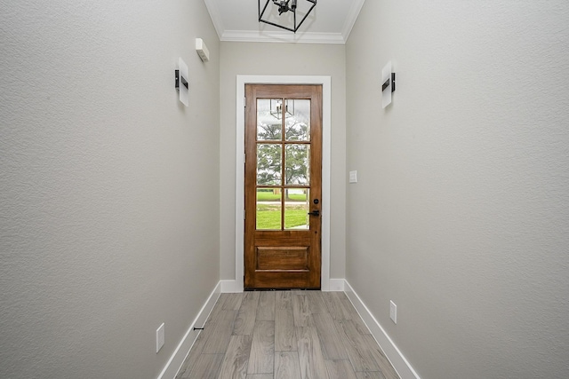 635 Lily St, Prairie View, TX 77484 - entryway with ornamental molding, light wood-style flooring, and a chandelier