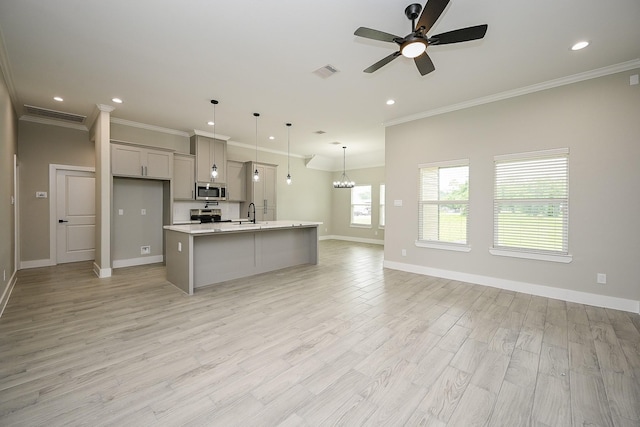 635 Lily St, Prairie View, TX 77484 - kitchen featuring stainless steel appliances, light countertops, ceiling fan, a center island with sink, and recessed lighting