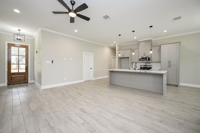 635 Lily St, Prairie View, TX 77484 - kitchen with appliances with stainless steel finishes, recessed lighting, light countertops, a kitchen island with sink, and ceiling fan