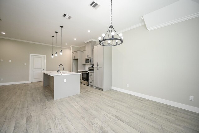 635 Lily St, Prairie View, TX 77484 - kitchen with appliances with stainless steel finishes, ornamental molding, light countertops, a chandelier, and recessed lighting