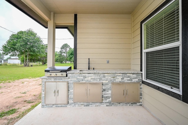 635 Lily St, Prairie View, TX 77484 - view of patio featuring a sink and exterior kitchen