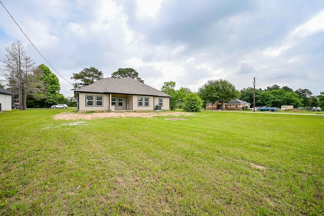 635 Lily St, Prairie View, TX 77484 - rear view of property with a yard
