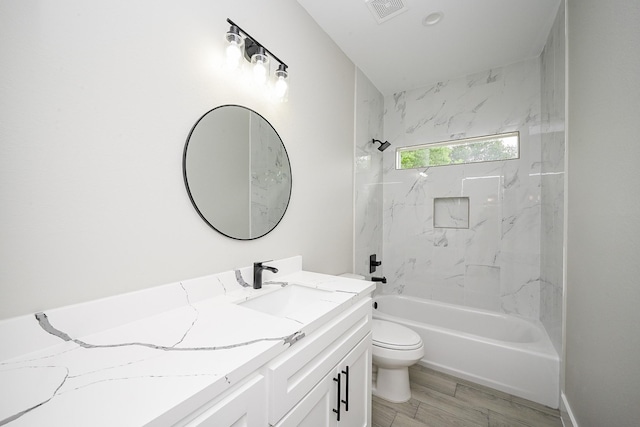 635 Lily St, Prairie View, TX 77484 - full bathroom with vanity, tub / shower combination, and wood finished floors