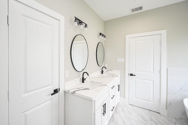 635 Lily St, Prairie View, TX 77484 - full bath with marble finish flooring, double vanity, and a freestanding tub