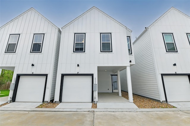 modern farmhouse style home with an attached garage and board and batten siding