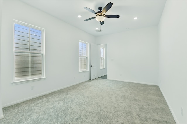 spare room featuring baseboards, ceiling fan, recessed lighting, and carpet