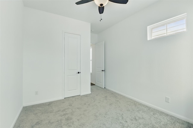 unfurnished bedroom with baseboards, ceiling fan, and carpet flooring
