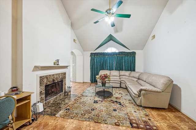 16023 Williwaw Dr, Houston, TX 77083 - living room with lofted ceiling, visible vents, a premium fireplace, and a ceiling fan