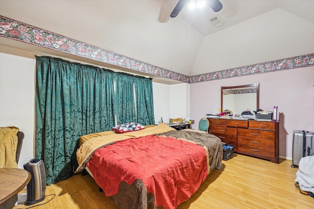 16023 Williwaw Dr, Houston, TX 77083 - bedroom with vaulted ceiling, light wood finished floors, baseboards, visible vents, and ceiling fan