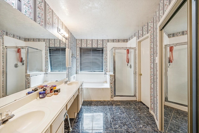 16023 Williwaw Dr, Houston, TX 77083 - full bathroom featuring a stall shower, wallpapered walls, a sink, and a textured ceiling