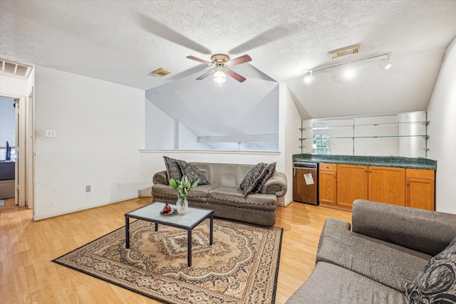 16023 Williwaw Dr, Houston, TX 77083 - living room with light wood finished floors, visible vents, ceiling fan, and lofted ceiling