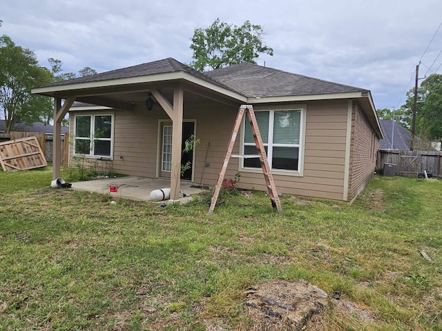 1710 Penina Dr, Crosby, TX 77532 - back of property featuring a yard, central air condition unit, a fenced backyard, and a patio