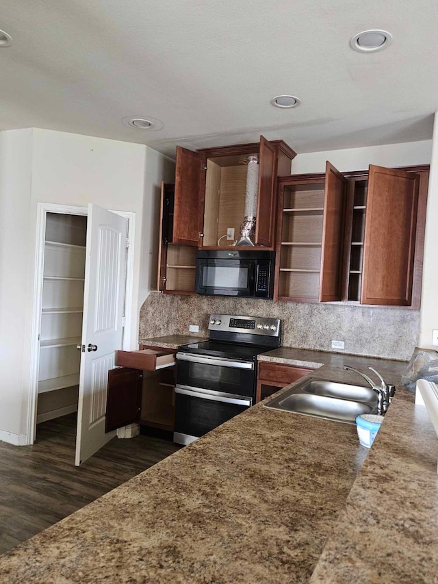 1710 Penina Dr, Crosby, TX 77532 - kitchen featuring open shelves, a sink, black microwave, range with two ovens, and dark wood-style flooring