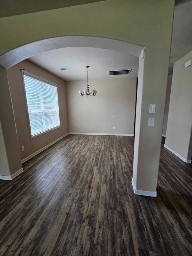 1710 Penina Dr, Crosby, TX 77532 - unfurnished dining area featuring a chandelier, dark wood finished floors, visible vents, and baseboards