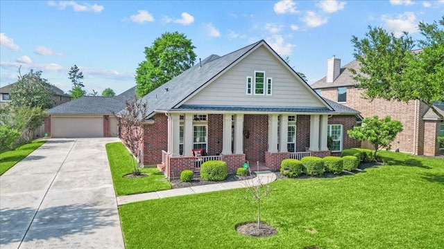 2052 Doolan Dr, Conroe, TX 77301 - view of front of house featuring a porch, brick siding, a front lawn, and driveway
