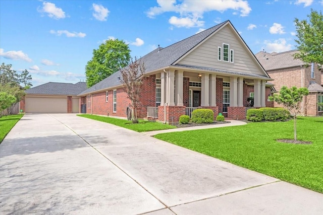 2052 Doolan Dr, Conroe, TX 77301 - greek revival inspired property with brick siding, a porch, driveway, a front lawn, and a garage