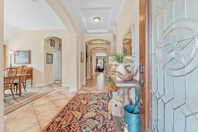 2052 Doolan Dr, Conroe, TX 77301 - entrance foyer featuring arched walkways, light tile patterned floors, baseboards, and crown molding
