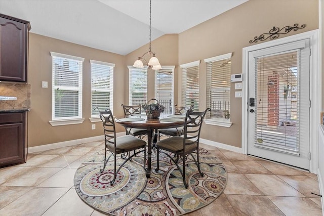 2052 Doolan Dr, Conroe, TX 77301 - dining room with baseboards, a chandelier, lofted ceiling, and light tile patterned flooring