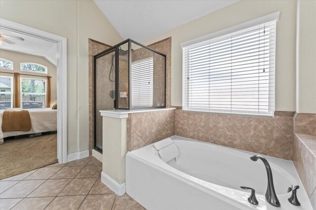2052 Doolan Dr, Conroe, TX 77301 - full bath with vaulted ceiling, a stall shower, ensuite bathroom, a garden tub, and ceiling fan