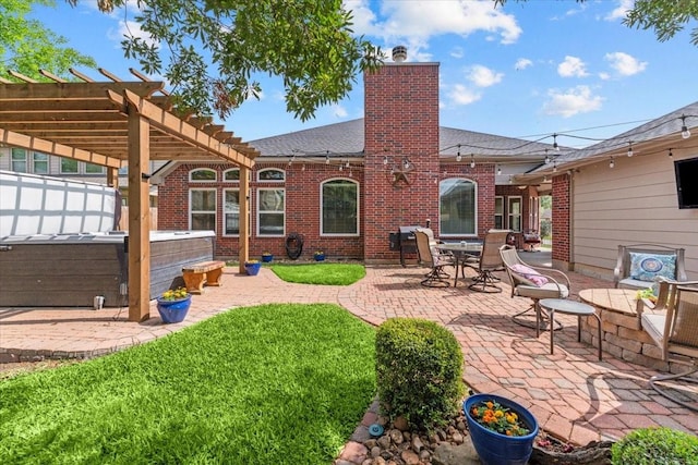 2052 Doolan Dr, Conroe, TX 77301 - rear view of property featuring a hot tub, a patio area, roof with shingles, and brick siding