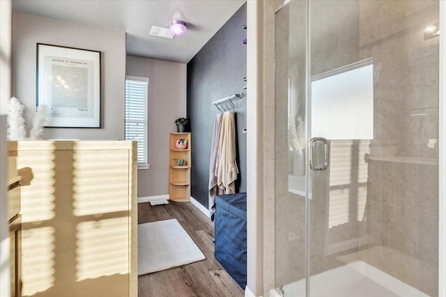 5510 Brooklyn Rose Dr, Rosharon, TX 77583 - bathroom featuring wood finished floors, a shower stall, and baseboards
