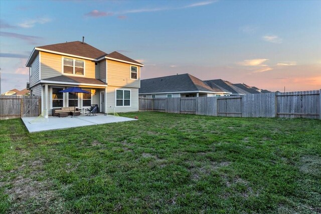 5510 Brooklyn Rose Dr, Rosharon, TX 77583 - back of property at dusk with a patio area