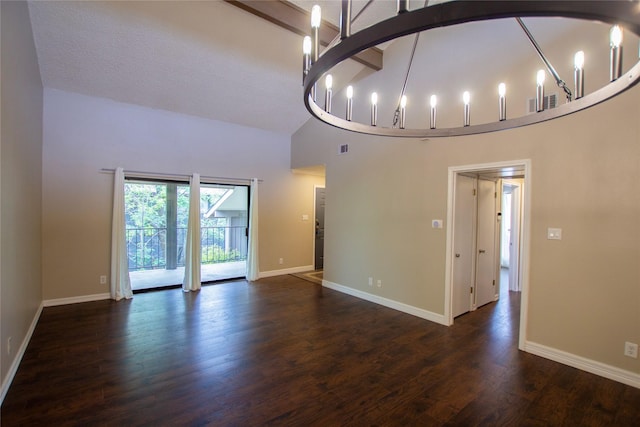 8615 Putnam Dr Unit C, Austin, TX 78757 - unfurnished living room with wood finished floors, a chandelier, baseboards, and high vaulted ceiling
