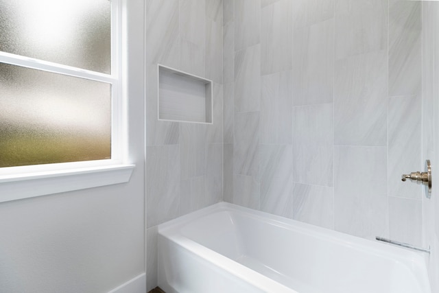 bathroom featuring washtub / shower combination