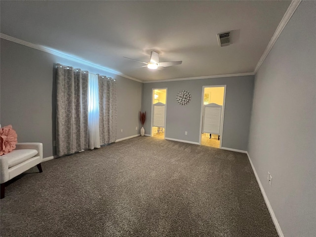 unfurnished bedroom with baseboards, carpet flooring, ensuite bathroom, crown molding, and visible vents