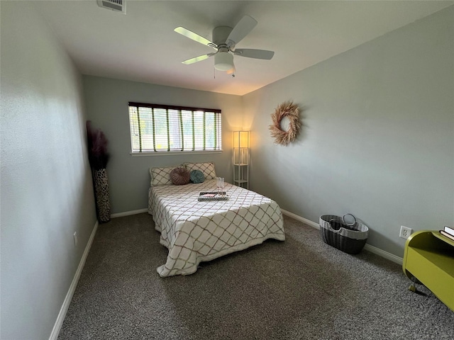 carpeted bedroom with visible vents, baseboards, and a ceiling fan