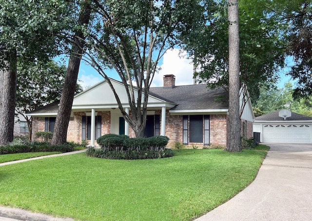 view of front of property featuring an outdoor structure, a front yard, brick siding, a chimney, and a shingled roof