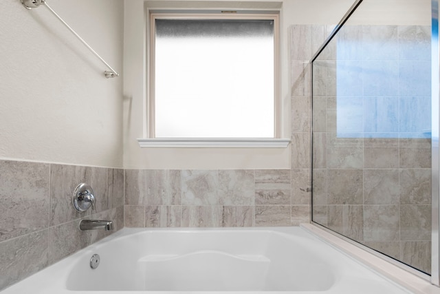 bathroom featuring a bath