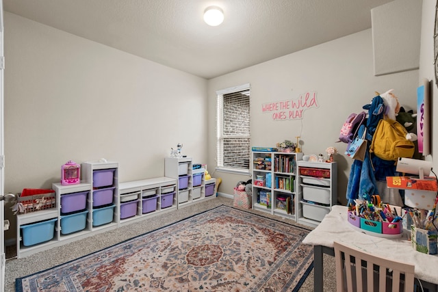 playroom with carpet flooring and baseboards